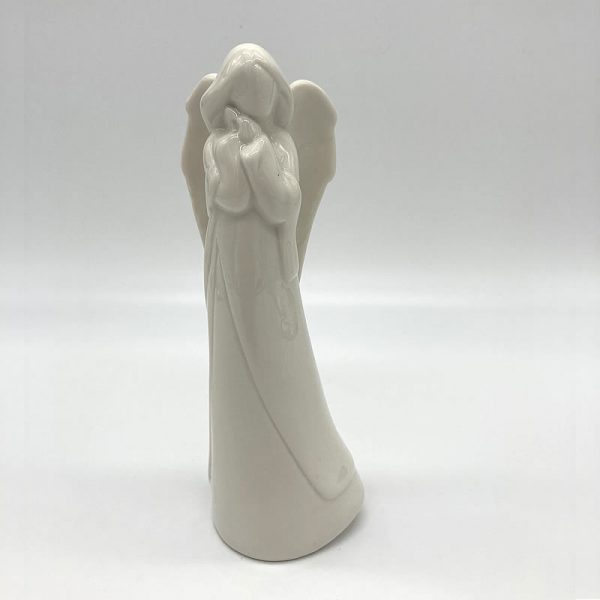 Porcelain Angel hands to cheek