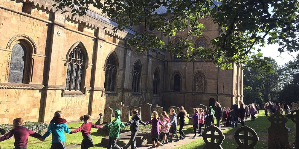 Children encircling the Minster